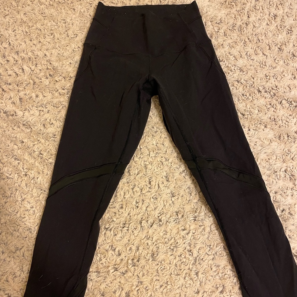 Cropped LuluLemon leggings with mesh detailing